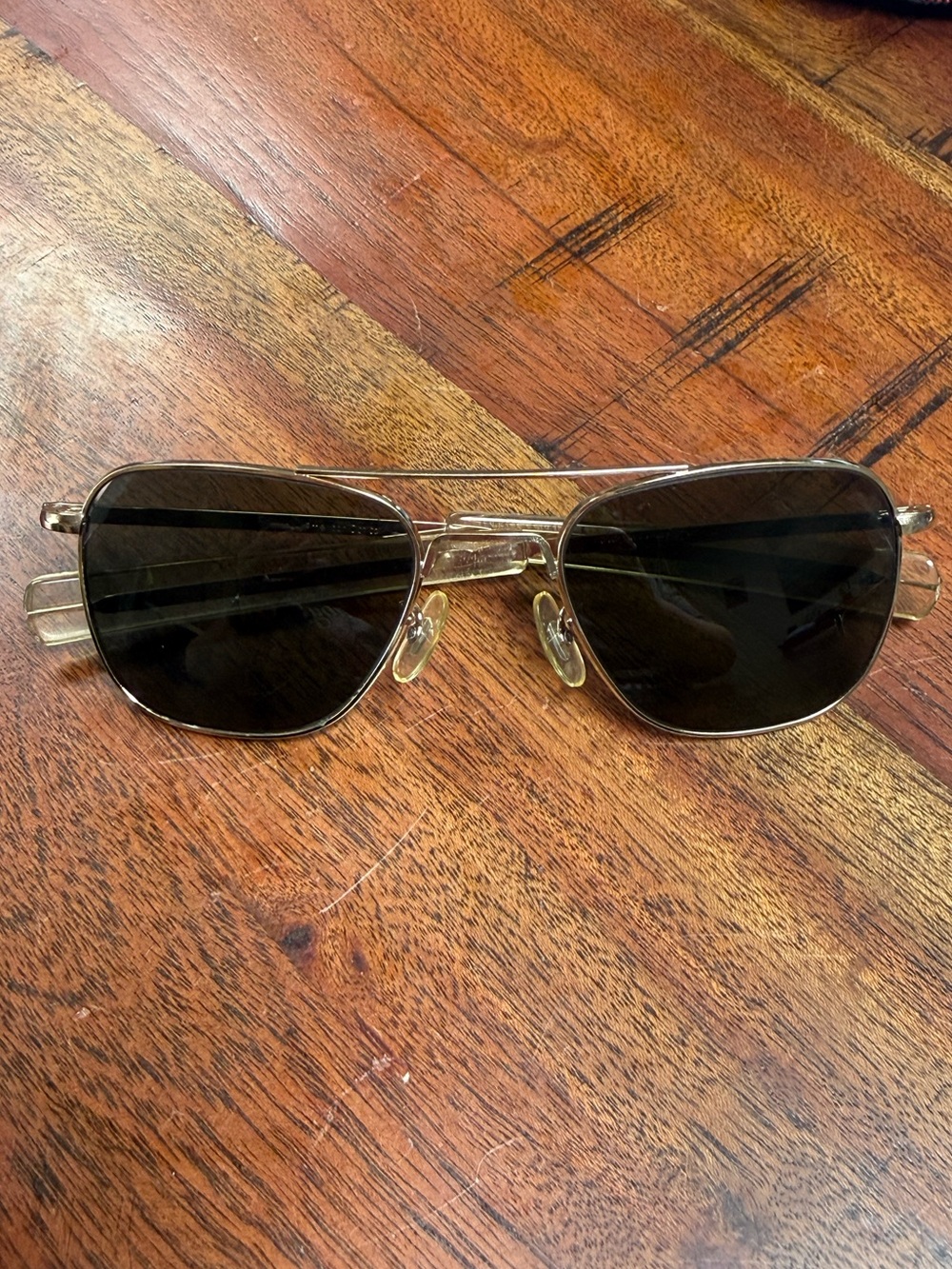 Vintage American Optical aviator sunglasses with gold frame